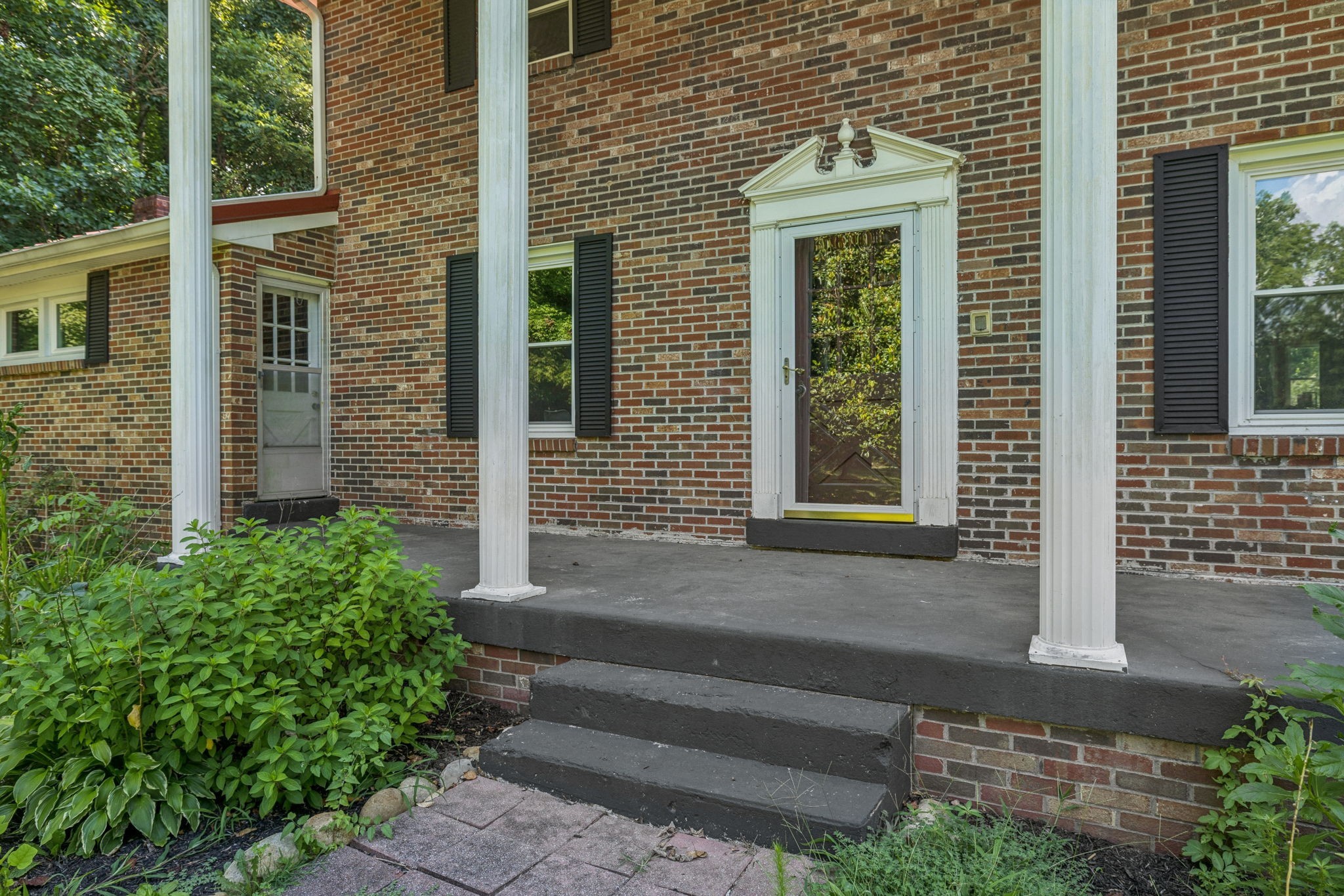 7199 Harper Road Joelton, TN 37080 - Photo 6 of 56 a front view of a house with a yard