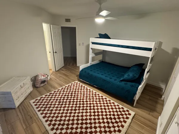 a bathroom with a shower and a sink