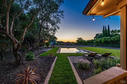 a view of yard with swimming pool and outdoor seating