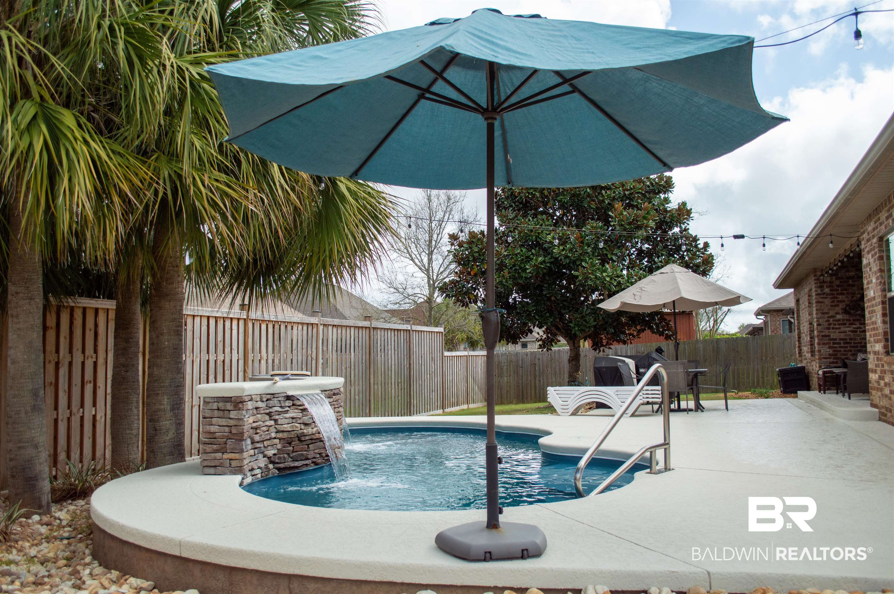 1124 West Orlando Drive Foley, AL 36535 - Photo 51 of 51 View of pool with patio surround and a fenced backyard