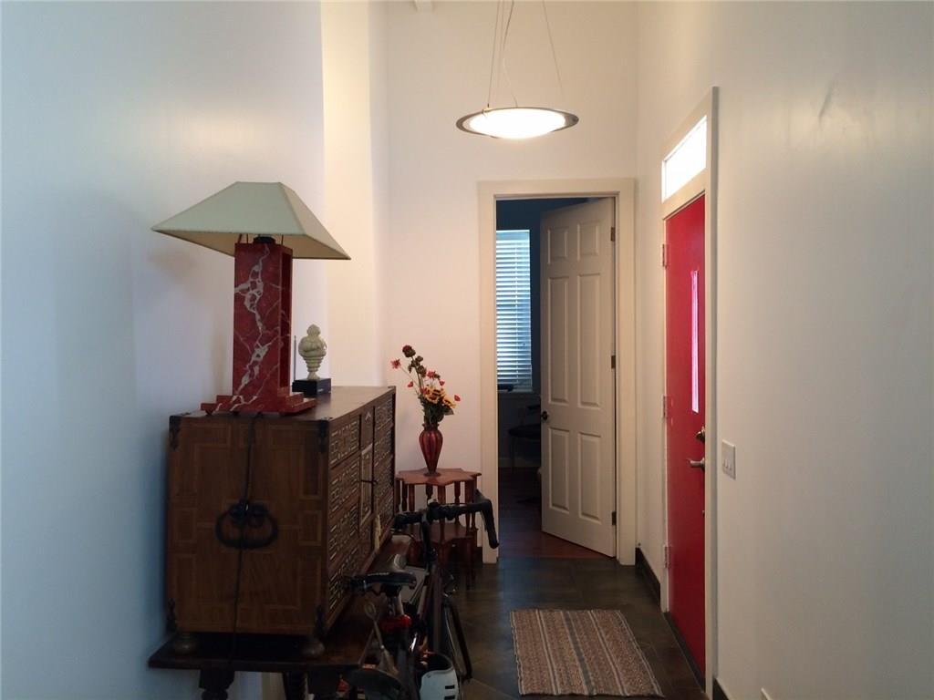 1371 Crampton Street, Unit 120 Dallas, TX 75207 - Photo 5 of 10 a view of a workspace with furniture and wooden floor