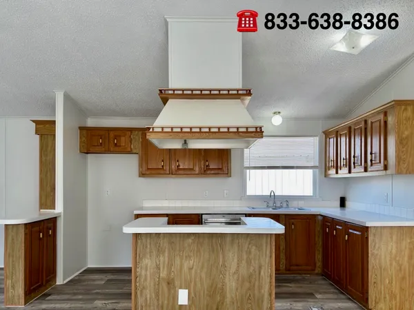 a kitchen with a stove a refrigerator and a sink