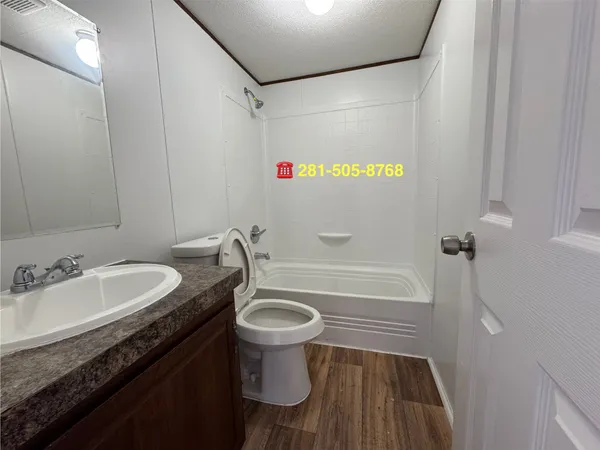 a bathroom with a sink a toilet and a bathtub