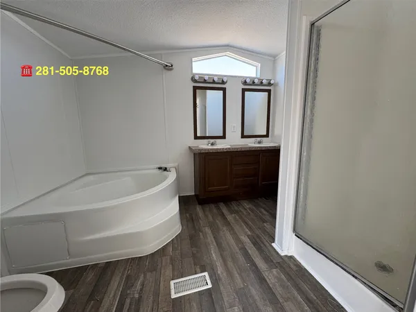 a bathroom with a bathtub and a sink