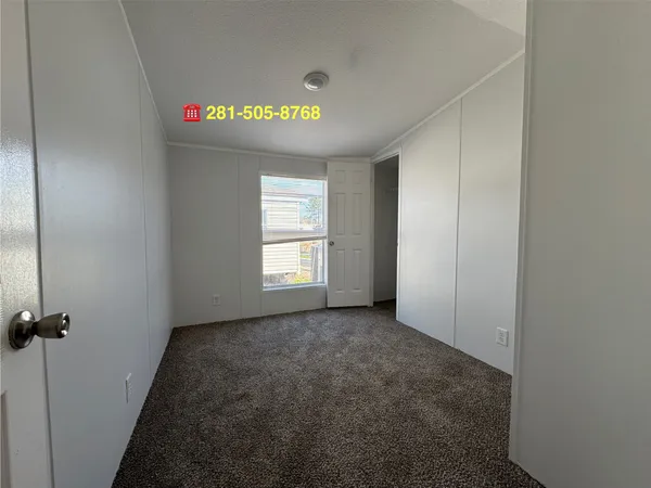 a view of empty room with windows