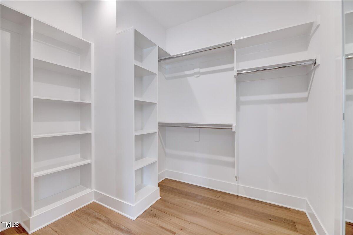 811 Maple Berry Lane, Unit 106 Raleigh, NC 27607 - Photo 15 of 30 a view of walk in closet with empty racks