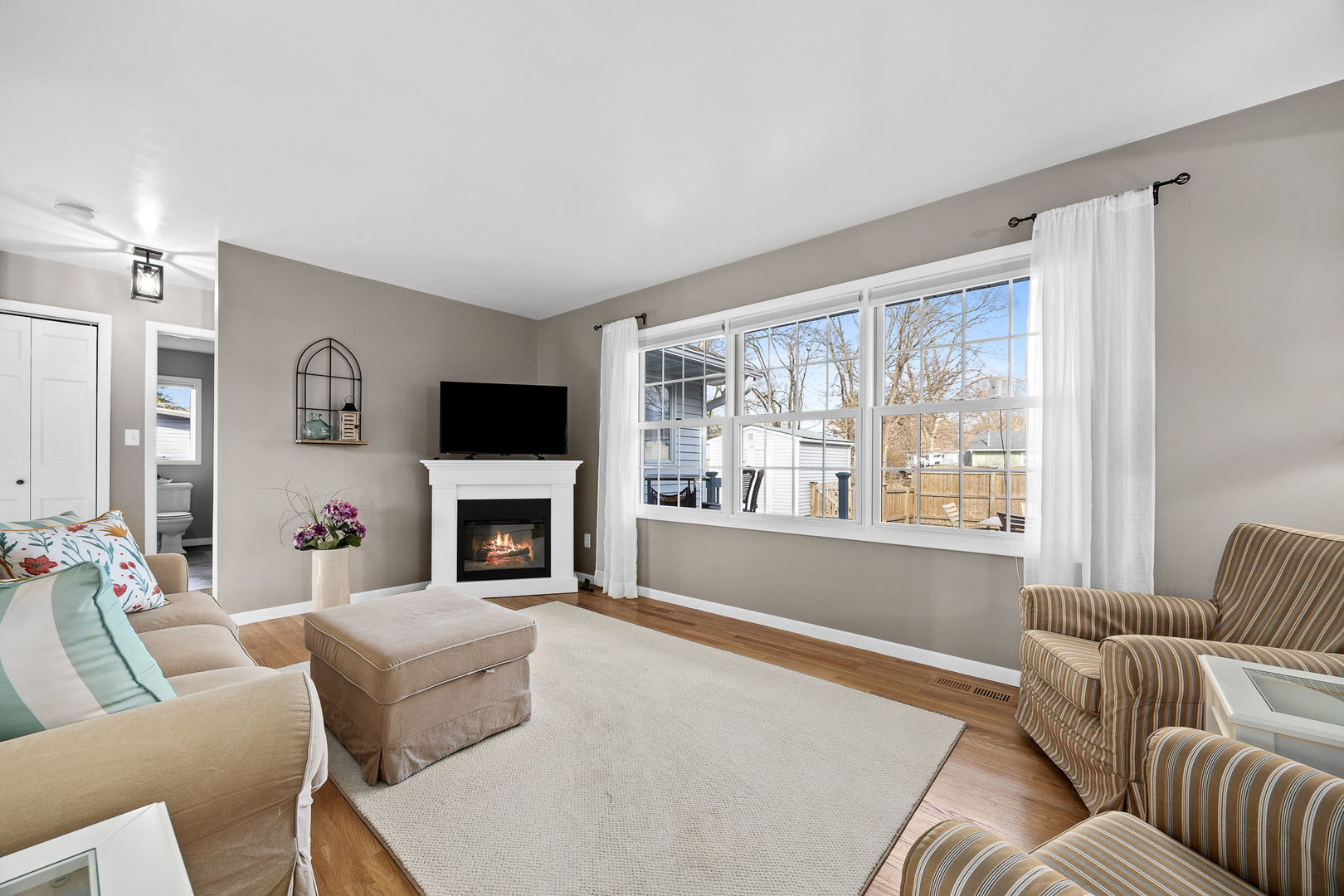 3560 Bass Court Morris, IL 60450 - Photo 14 of 34 a living room with furniture a window and a fireplace