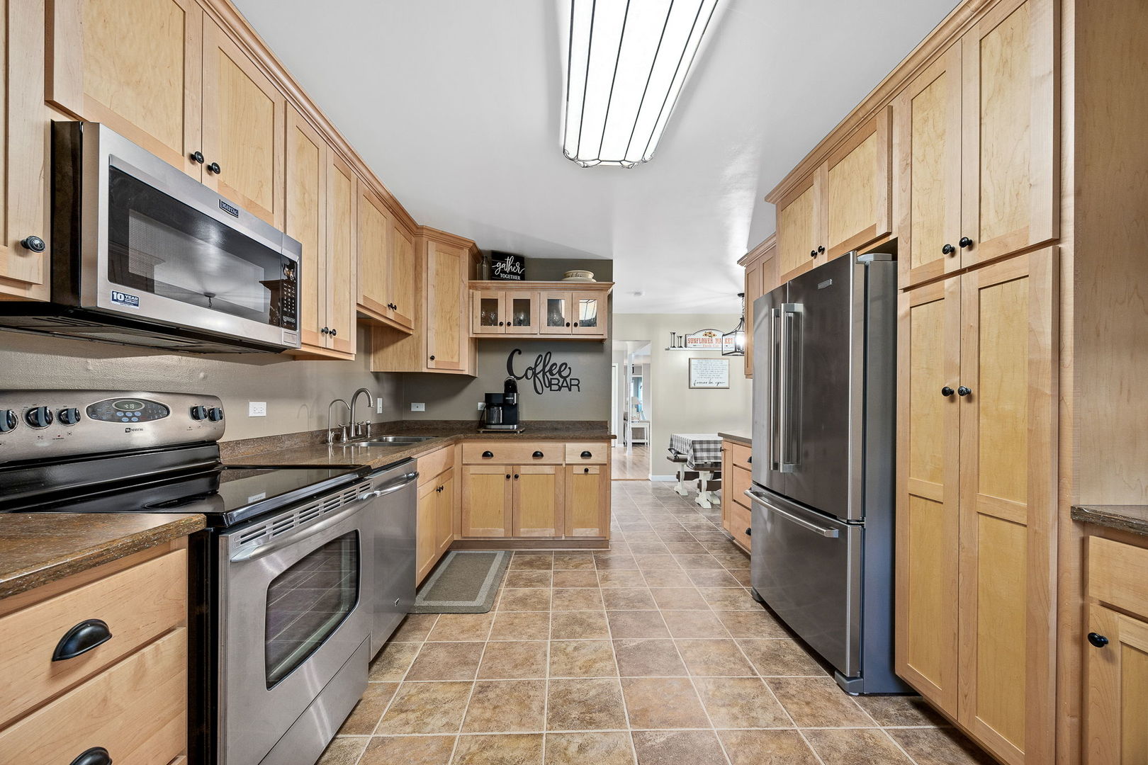 3560 Bass Court Morris, IL 60450 - Photo 3 of 34 a kitchen with stainless steel appliances a stove microwave and a refrigerator