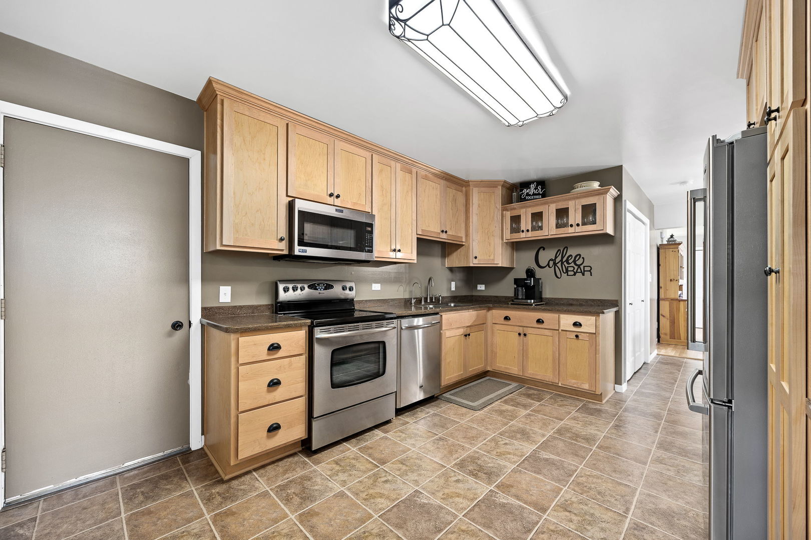3560 Bass Court Morris, IL 60450 - Photo 4 of 34 a kitchen with stainless steel appliances granite countertop a refrigerator and a stove top oven