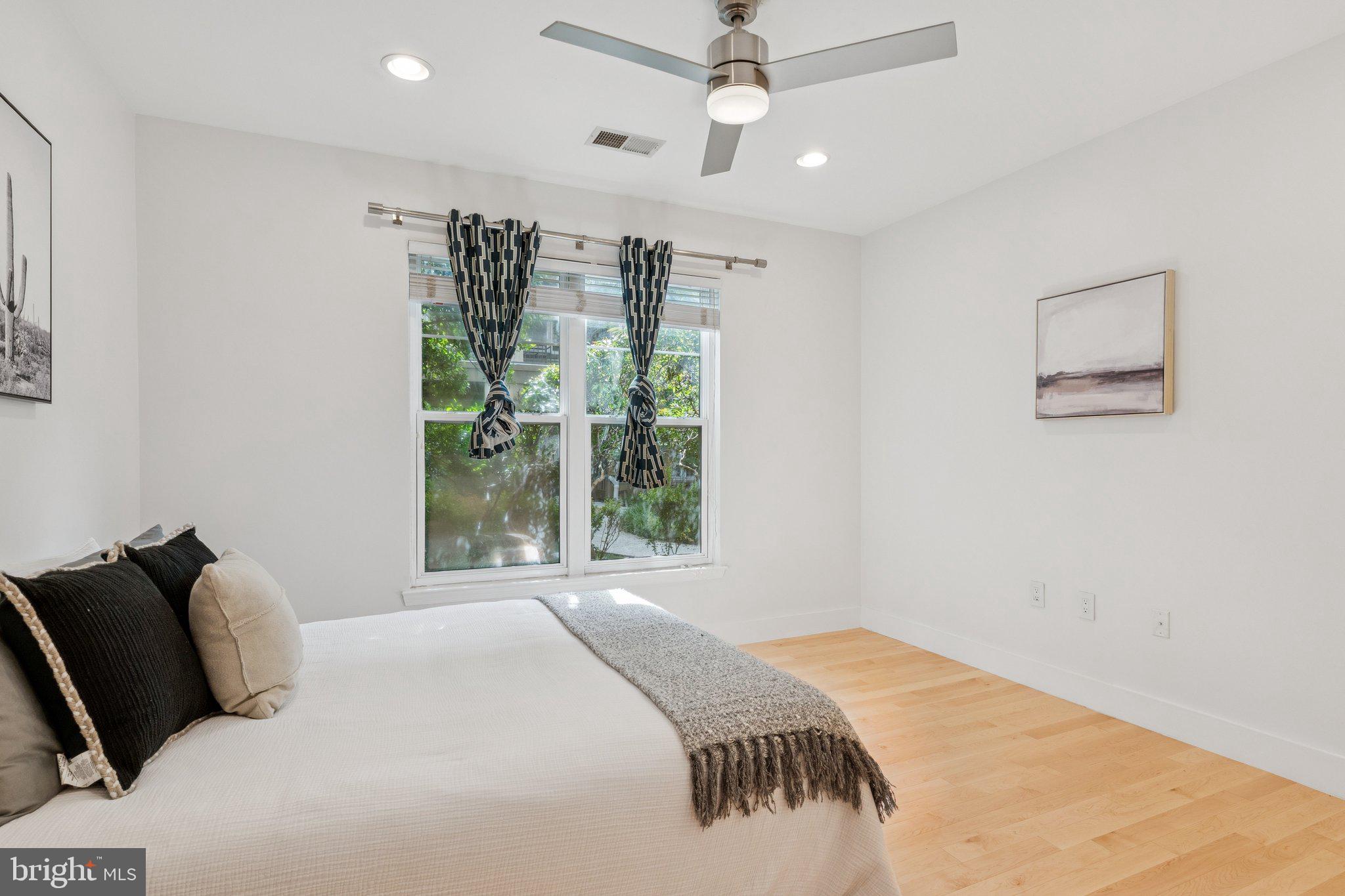 11800 Old Georgetown Road, Unit 1120 North Bethesda, MD 20852 - Photo 15 of 36 a bedroom with a large bed and a window