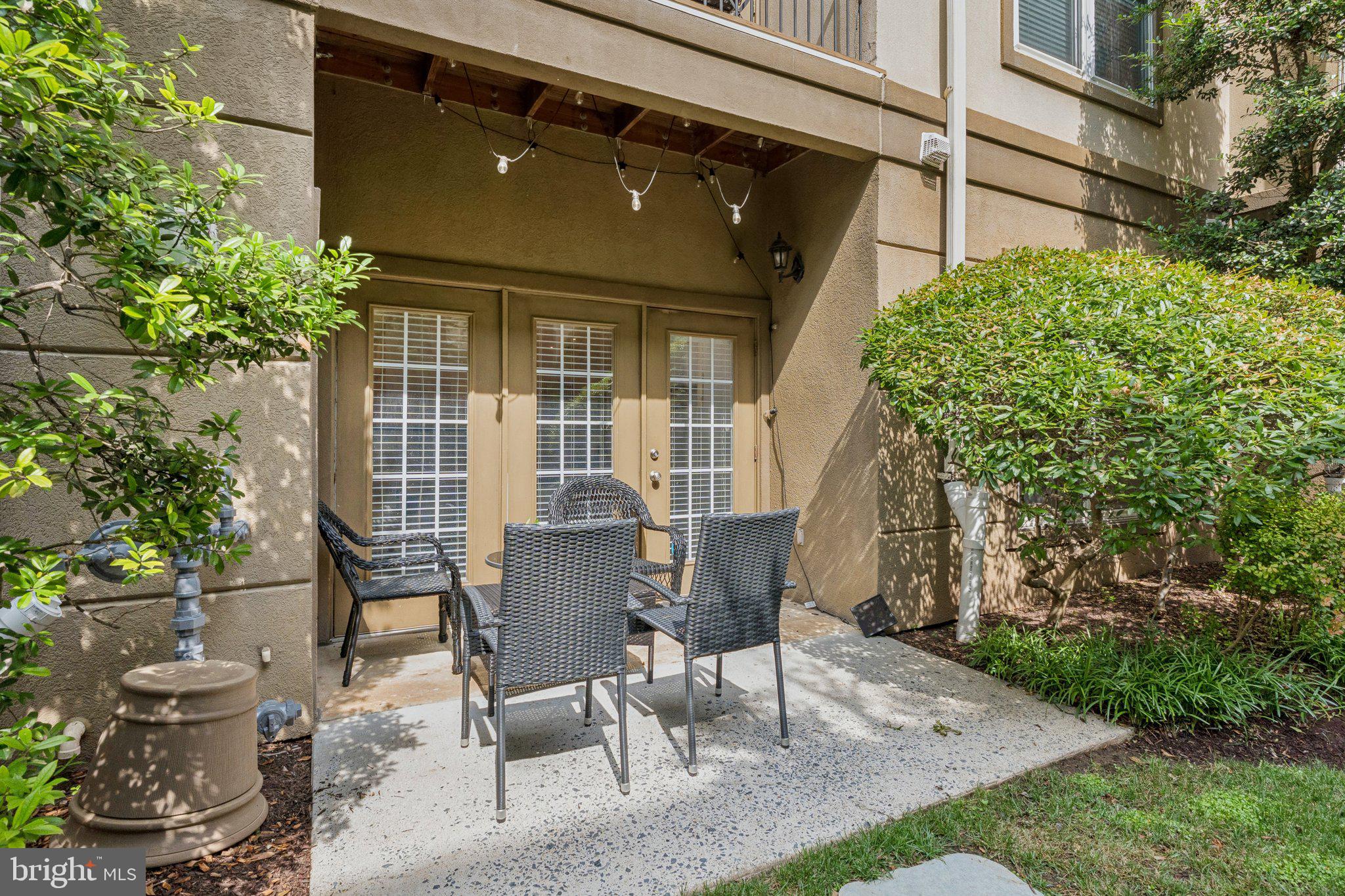 11800 Old Georgetown Road, Unit 1120 North Bethesda, MD 20852 - Photo 18 of 36 a view of a patio with table and chairs and potted plants