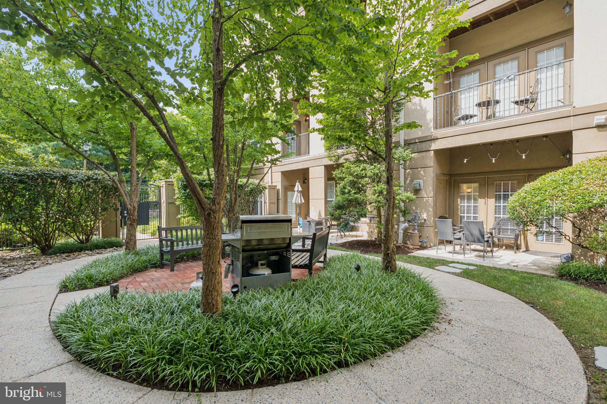 11800 Old Georgetown Road, Unit 1120 North Bethesda, MD 20852 - Photo 20 of 36 front view of a house with a garden