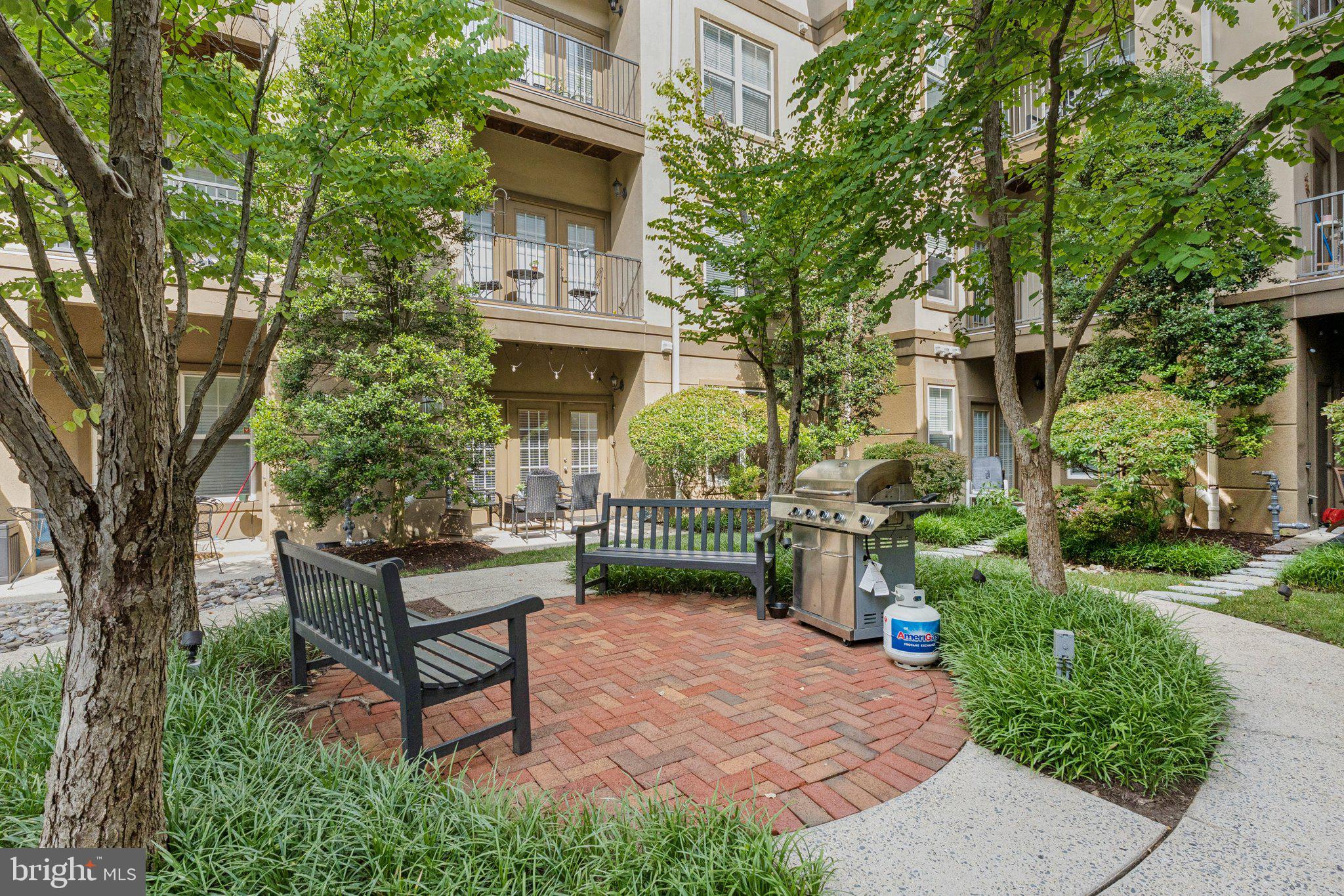 11800 Old Georgetown Road, Unit 1120 North Bethesda, MD 20852 - Photo 21 of 36 a view of a bench in a garden
