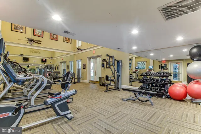 a view of lobby with furniture and a chandelier