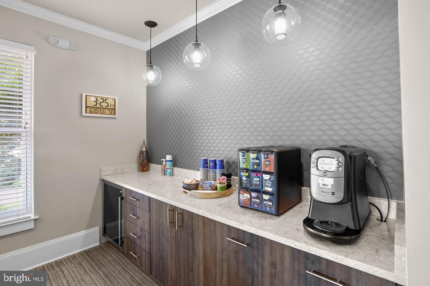 11800 Old Georgetown Road, Unit 1120 North Bethesda, MD 20852 - Photo 27 of 36 a room with a clock on wall and wooden floor