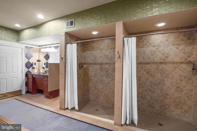 a bathroom with a shower and a sink