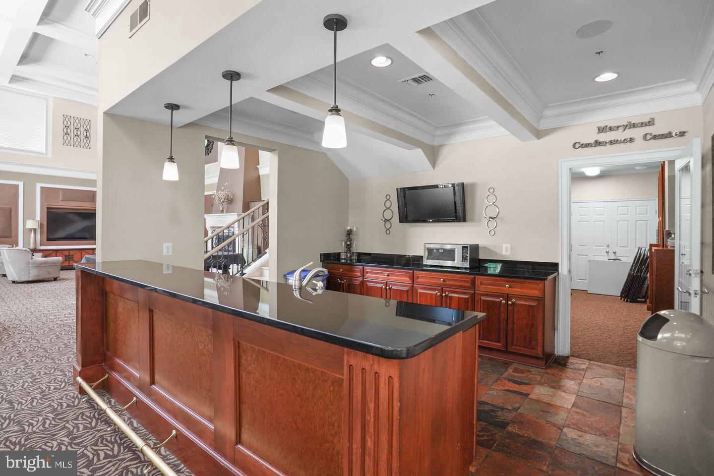 11800 Old Georgetown Road, Unit 1120 North Bethesda, MD 20852 - Photo 33 of 36 a kitchen with stainless steel appliances a sink stove and wooden floor