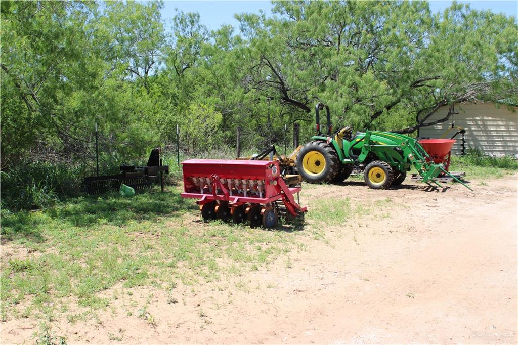 1645 Cr 288 Road Concepcion, TX 78349 - Photo 18 of 42 an outdoor sitting area with fire pit