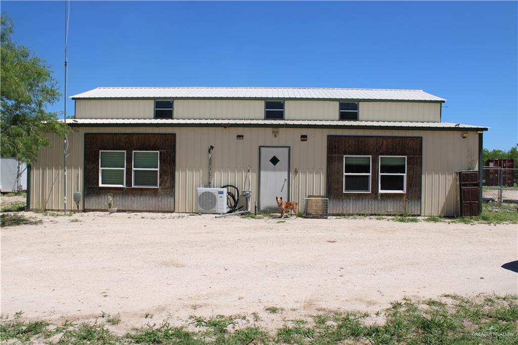 1645 Cr 288 Road Concepcion, TX 78349 - Photo 8 of 42 a front view of a house with a yard and garage