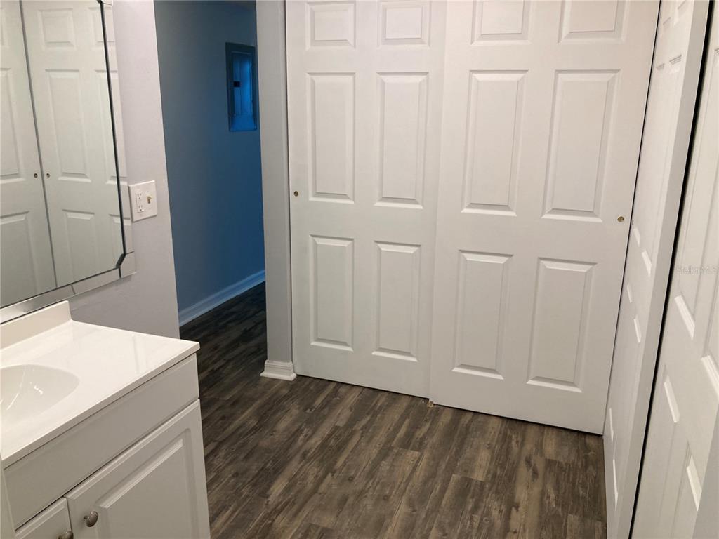 4908 38th Way South, Unit 303 St. Petersburg, FL 33711 - Photo 14 of 14 a view of a bathroom from the hallway
