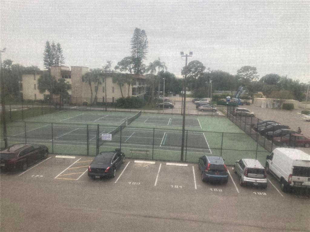 4908 38th Way South, Unit 303 St. Petersburg, FL 33711 - Photo 6 of 14 a view of a tennis court