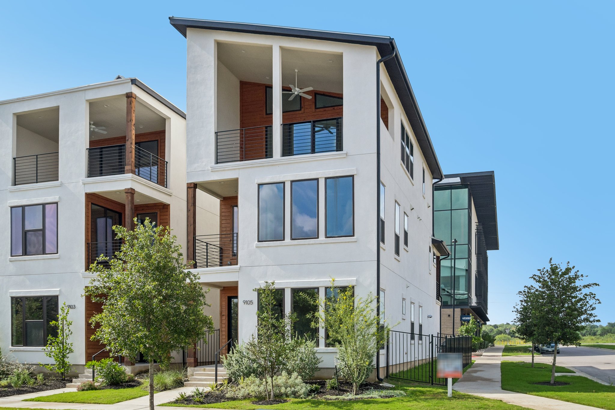 9105 Cattle Baron Path Austin, TX 78747 - Photo 3 of 31 Modern architecture with expansive windows defines this inviting urban dwelling.
