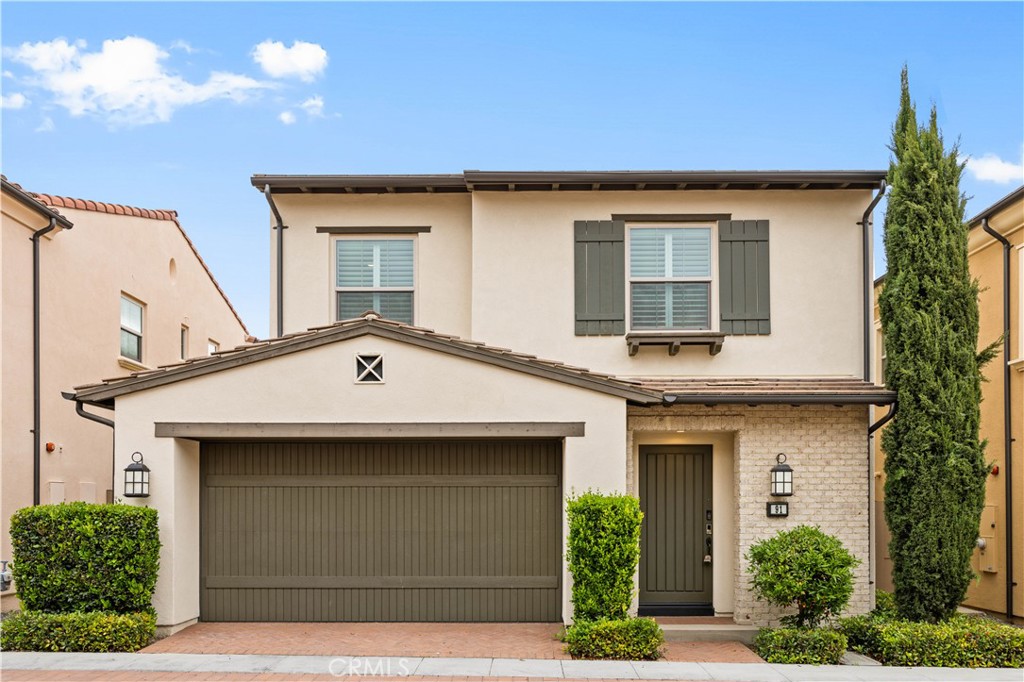 a front view of a house with garage