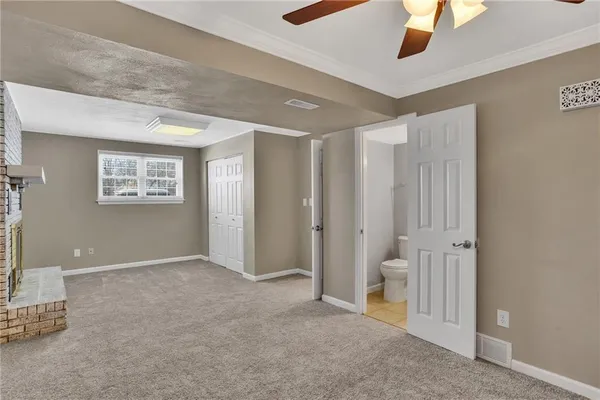 a view of an empty room with a window