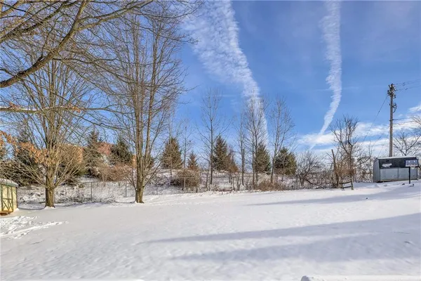 a view of road with snow on the road