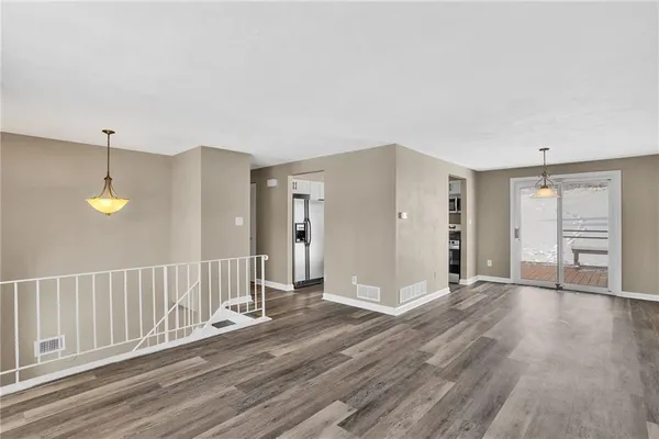 a view of a livingroom with wooden floor
