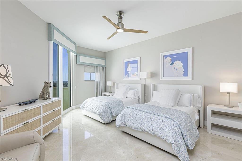 295 Grande Way, Unit PH2 Naples, FL 34110 - Photo 14 of 45 a bedroom with a bed and a window