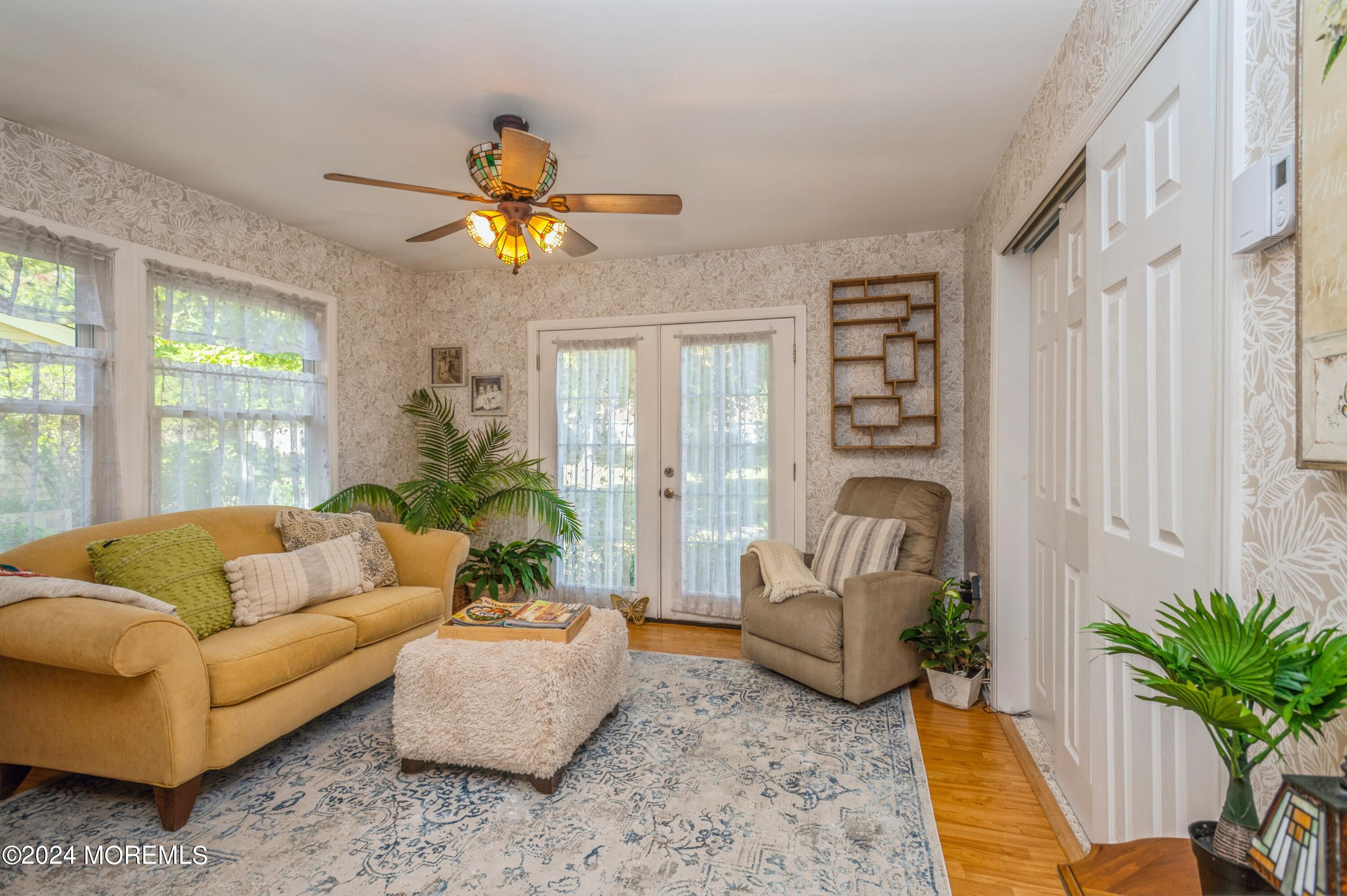 147 B Cours De Pasteur, Unit 1000 Freehold, NJ 07728 - Photo 12 of 28 a living room with furniture