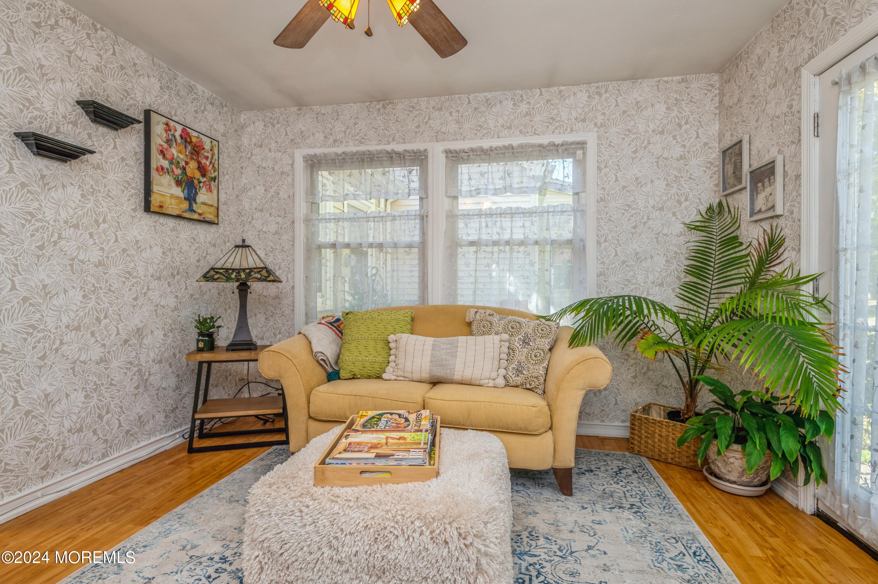 147 B Cours De Pasteur, Unit 1000 Freehold, NJ 07728 - Photo 14 of 28 a living room with furniture and a potted plant