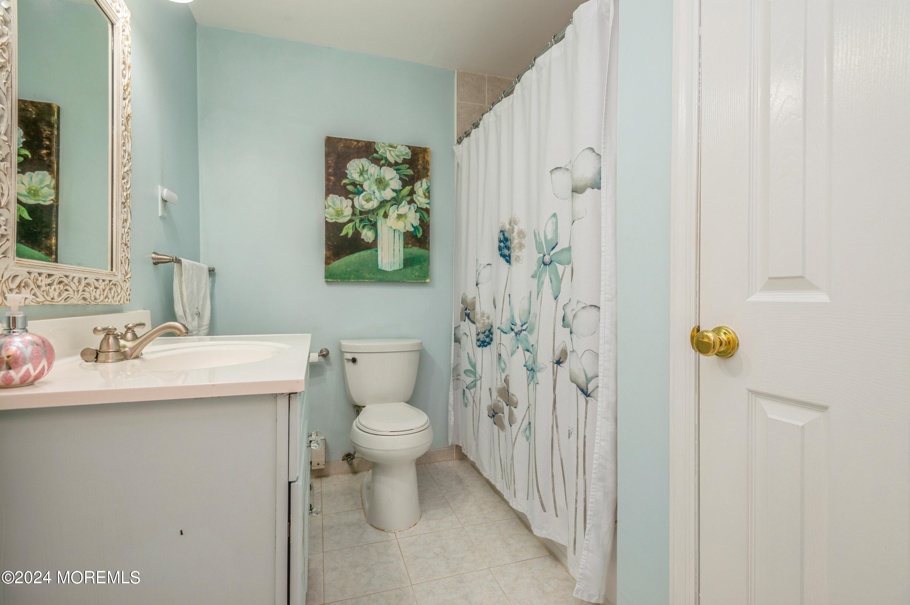 147 B Cours De Pasteur, Unit 1000 Freehold, NJ 07728 - Photo 19 of 28 a bathroom with a sink toilet and shower