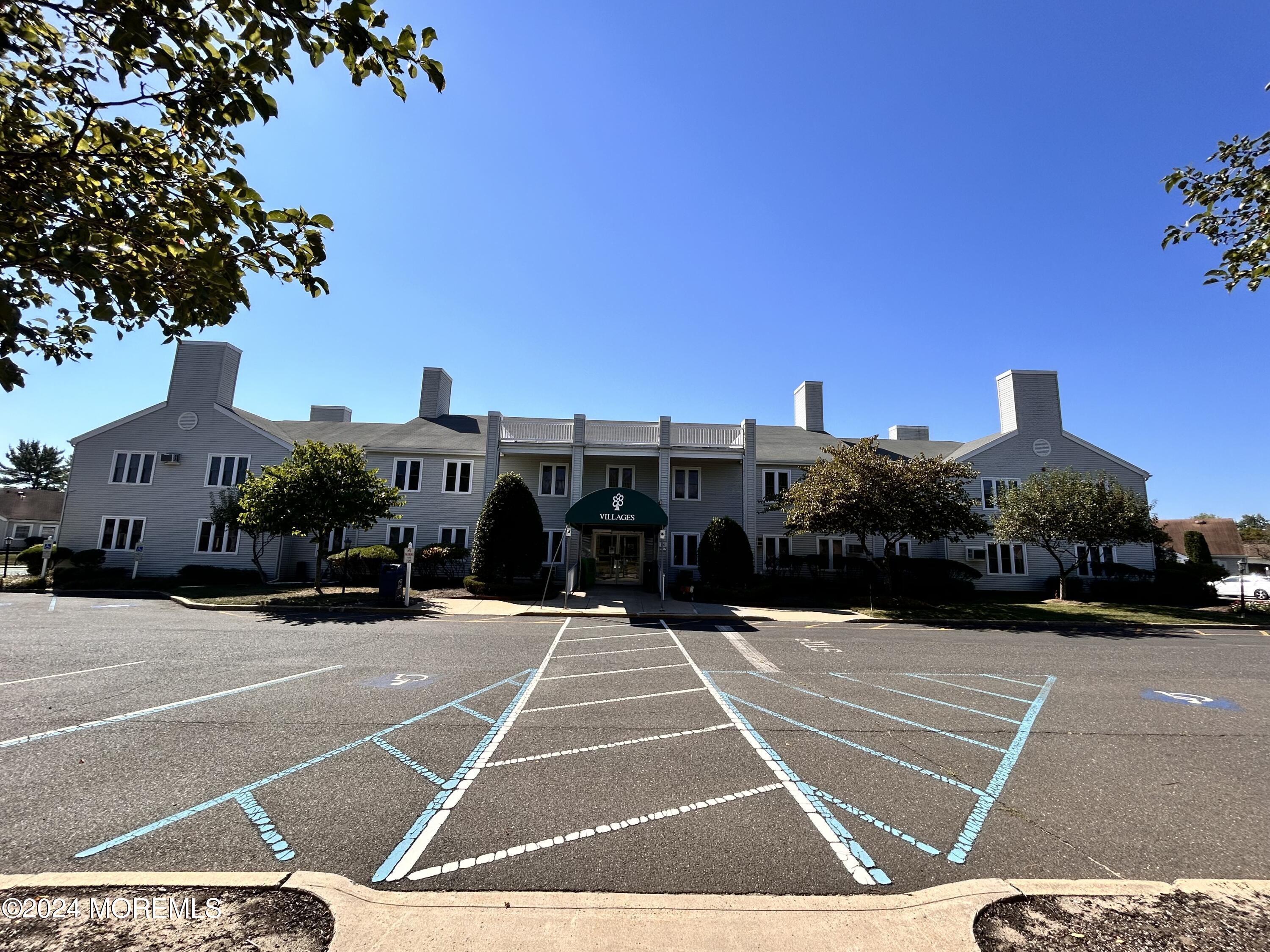 147 B Cours De Pasteur, Unit 1000 Freehold, NJ 07728 - Photo 23 of 28 a view of a tennis court