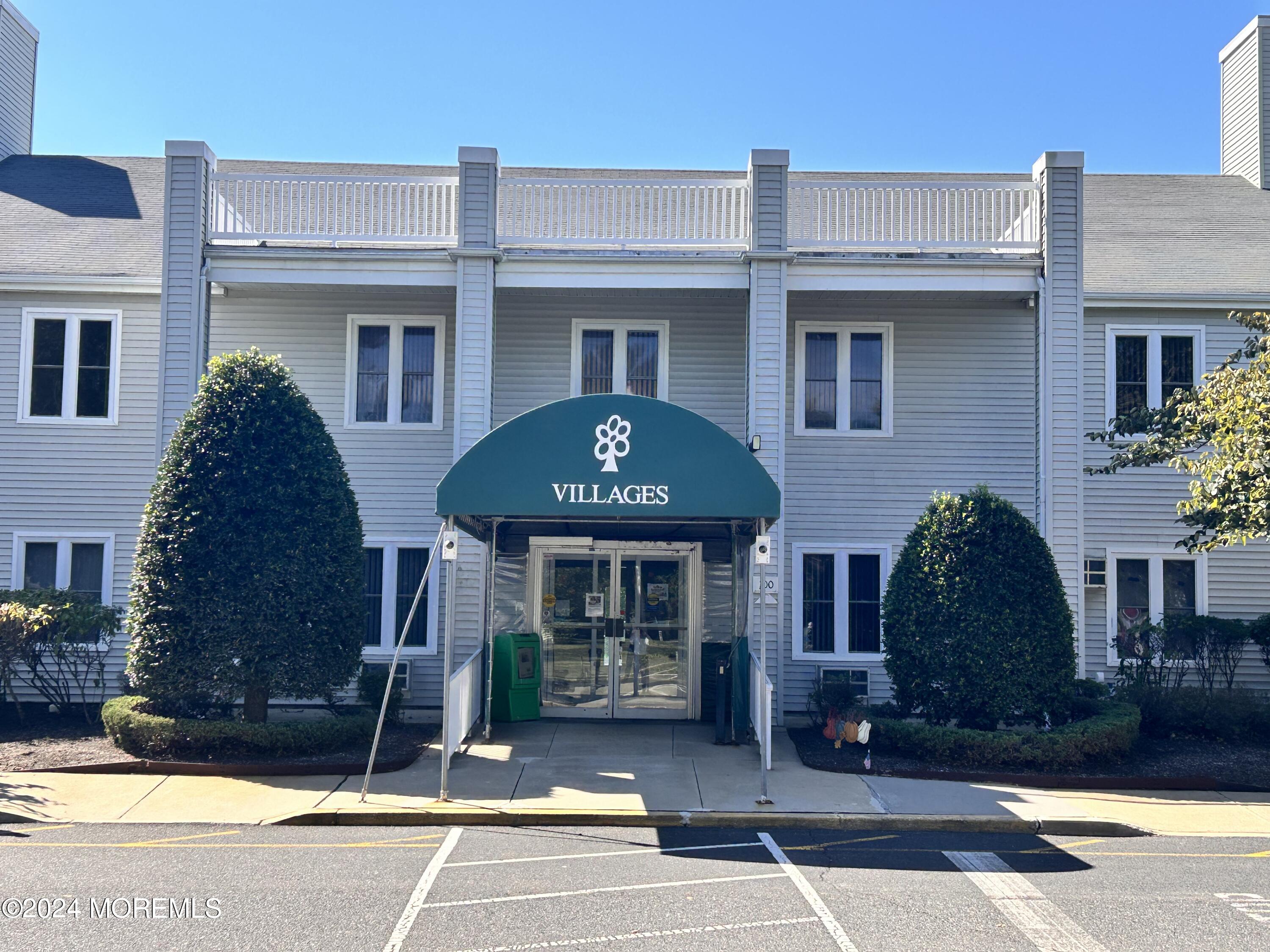 147 B Cours De Pasteur, Unit 1000 Freehold, NJ 07728 - Photo 24 of 28 a front view of a house