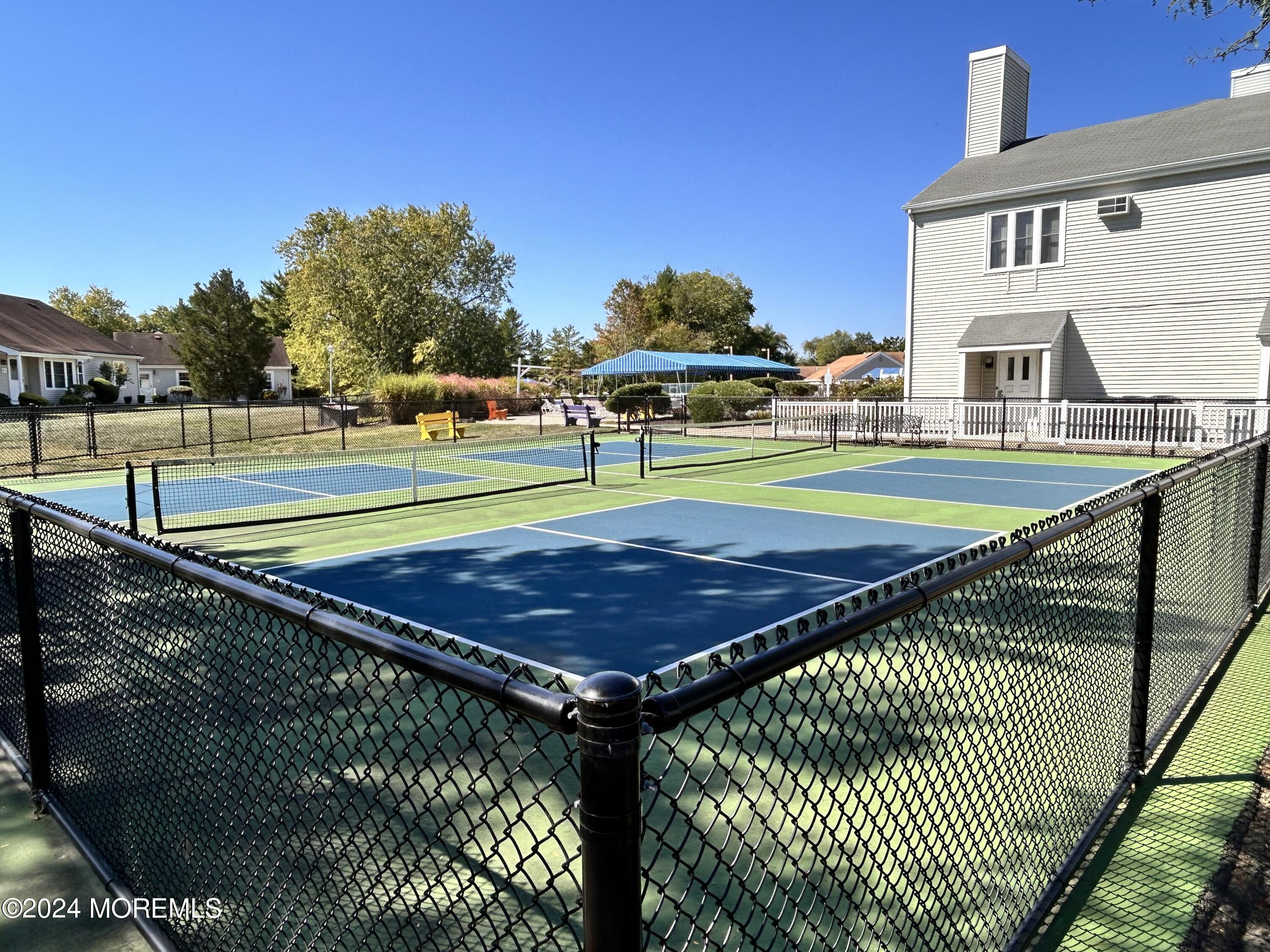 147 B Cours De Pasteur, Unit 1000 Freehold, NJ 07728 - Photo 25 of 28 a view of a tennis court
