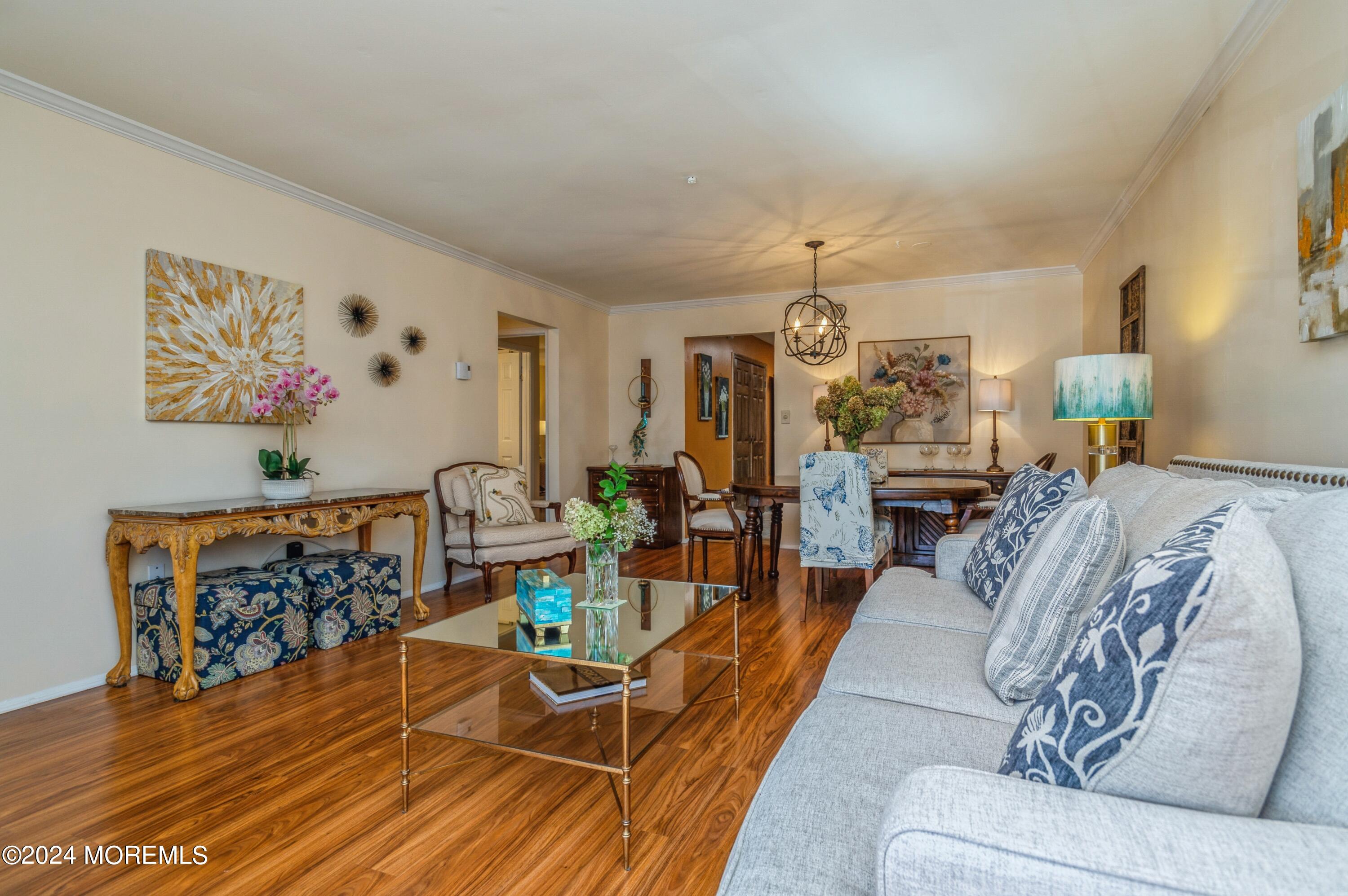 147 B Cours De Pasteur, Unit 1000 Freehold, NJ 07728 - Photo 5 of 28 a living room with furniture and a table