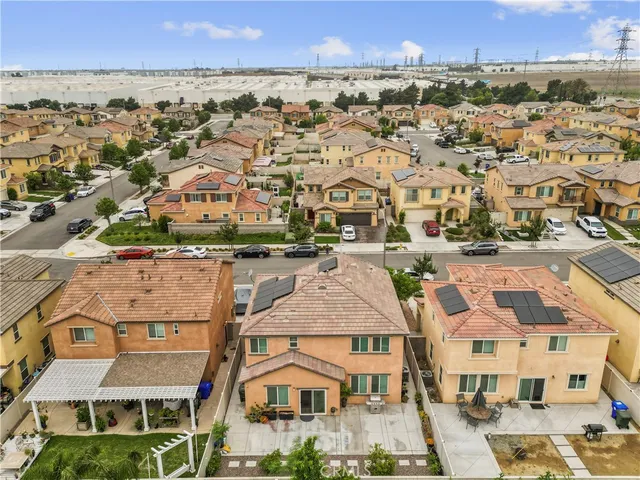 an aerial view of residential houses with outdoor space