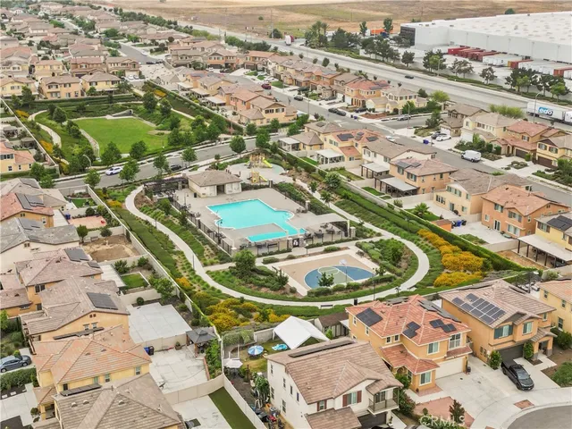 an aerial view of a residential houses with outdoor space