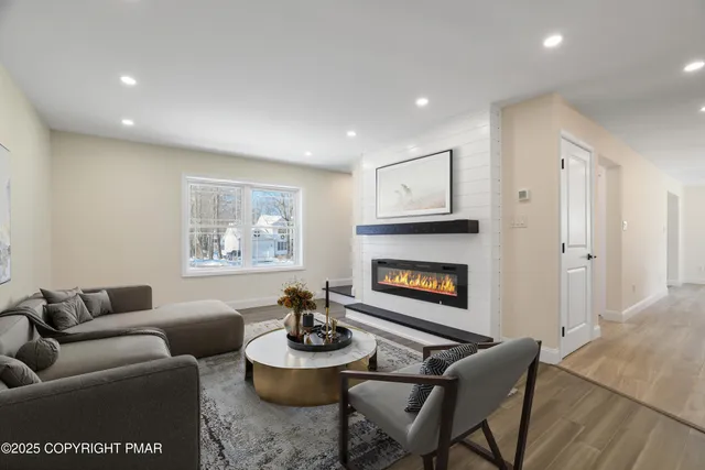 a large kitchen with a stove sink and cabinets
