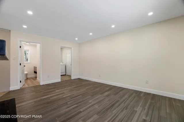 a bathroom with a sink a window and a mirror