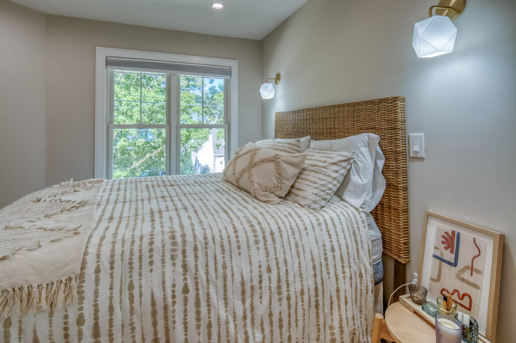 99 The Boulevard Edgartown, MA 02539 - Photo 25 of 35 a bedroom with a bed and a window