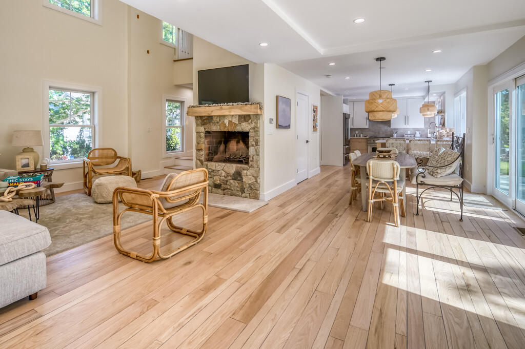 99 The Boulevard Edgartown, MA 02539 - Photo 3 of 35 a living room with furniture a fireplace and a flat screen tv