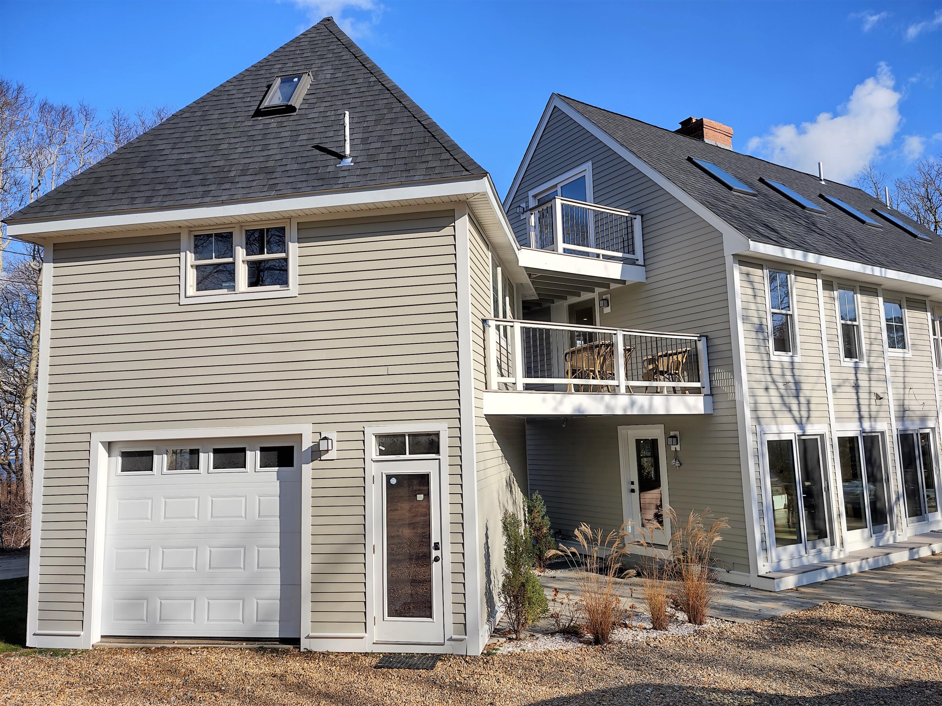 99 The Boulevard Edgartown, MA 02539 - Photo 34 of 35 a front view of a house with glass windows