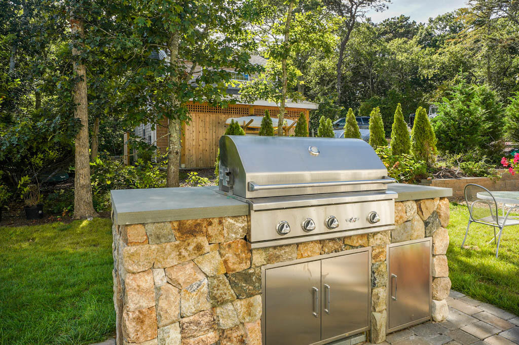 99 The Boulevard Edgartown, MA 02539 - Photo 7 of 35 a view of a backyard with sitting area