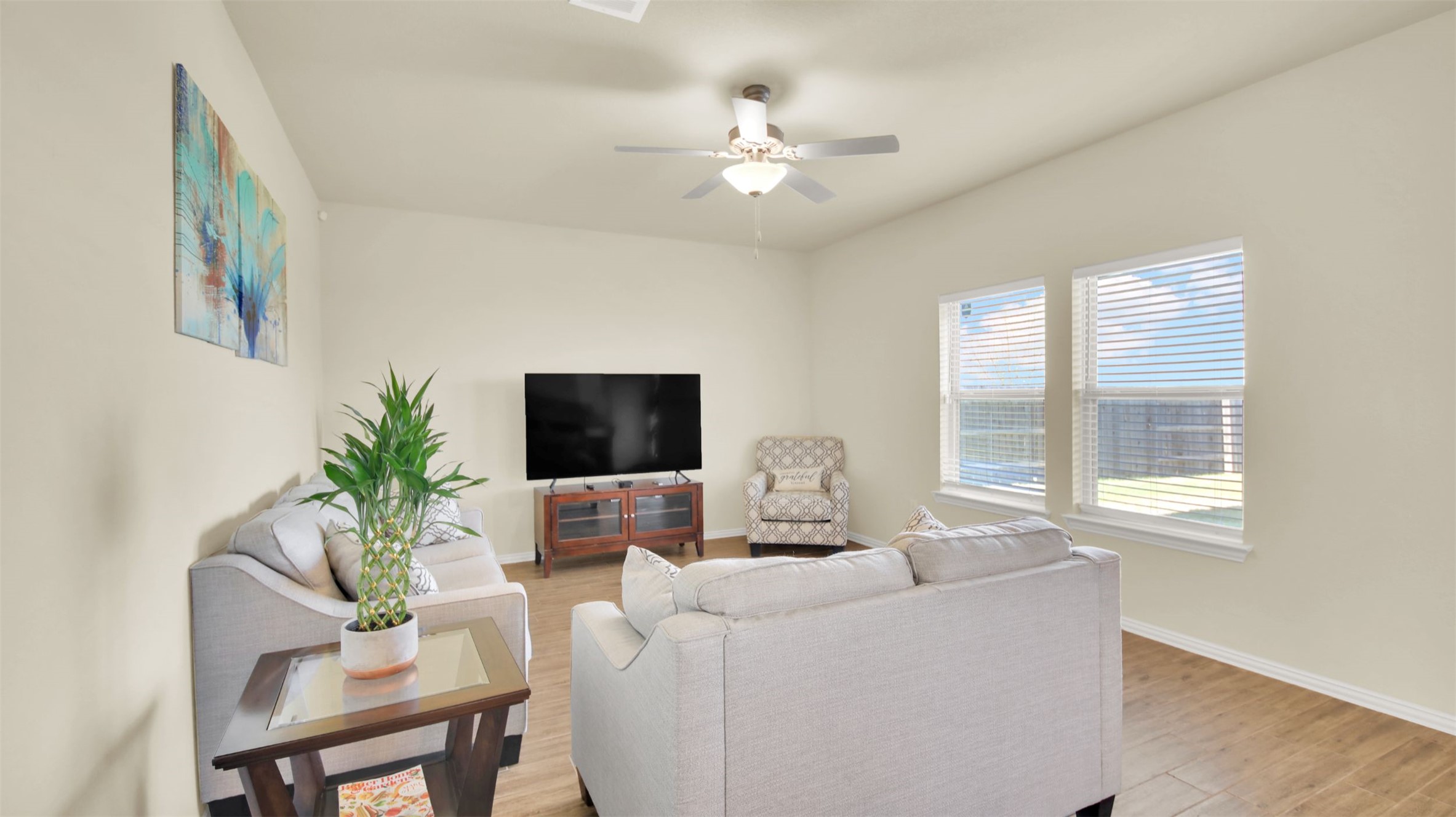 13716 Sugar Bush Path Manor, TX 78653 - Photo 16 of 37 Living area with ceiling fan and light wood-style floors