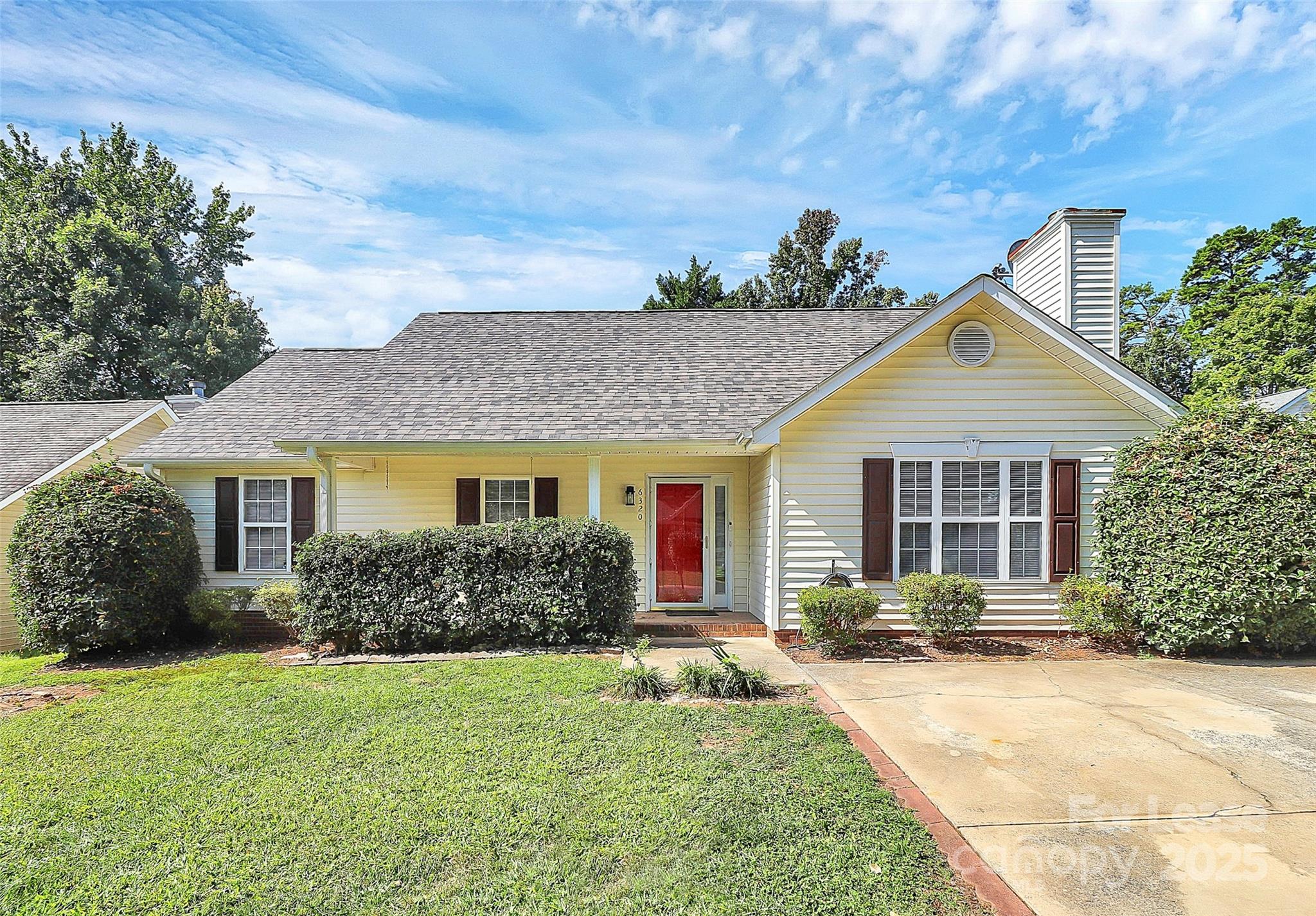 6320 Fresh Wind Avenue Charlotte, NC 28212 - Photo 1 of 31 a front view of house with yard and trees in the background