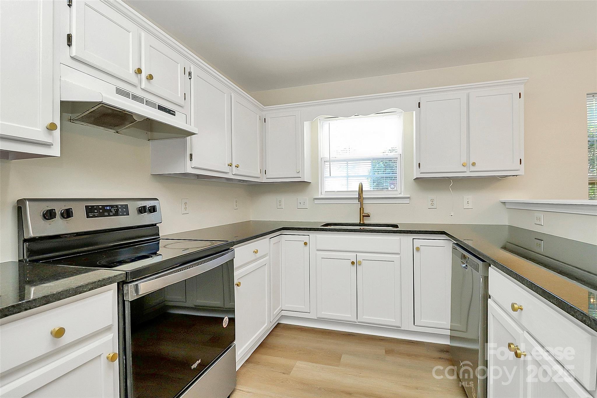 6320 Fresh Wind Avenue Charlotte, NC 28212 - Photo 14 of 31 a kitchen with cabinets appliances and a window