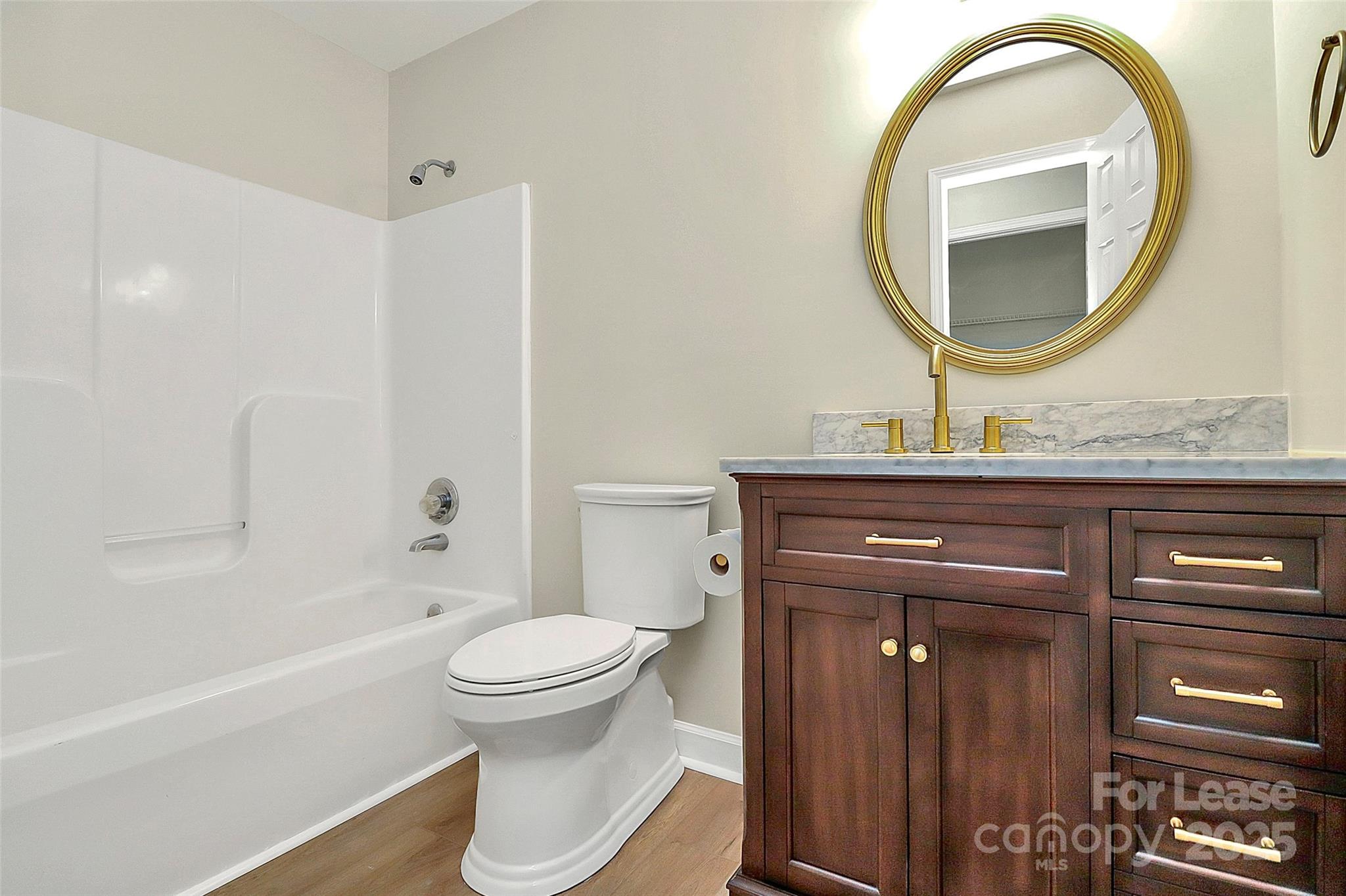 6320 Fresh Wind Avenue Charlotte, NC 28212 - Photo 26 of 31 a bathroom with a toilet a sink and a mirror